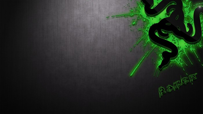 Razer logo with green splashes on a dark textured background