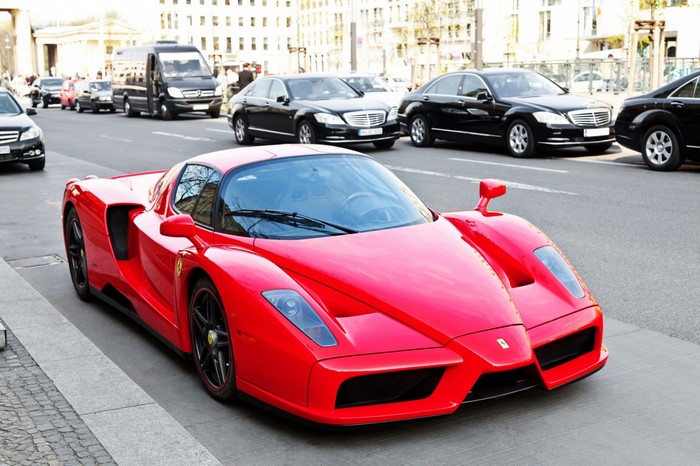 Red Ferrari Enzo Sports Car Parked on Street