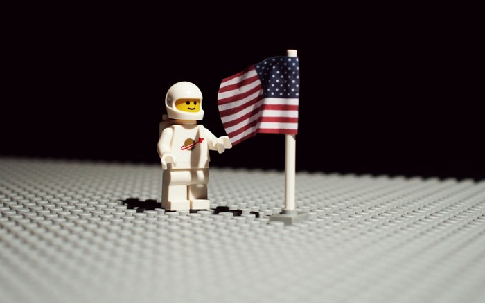 LEGO astronaut planting American flag on the Moon