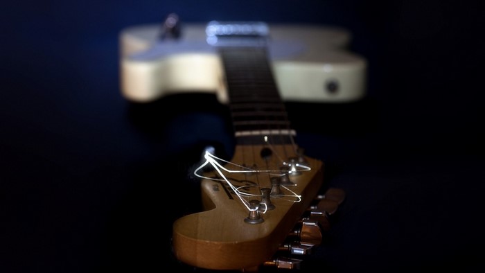 Close-up of an electric guitar headstock and neck