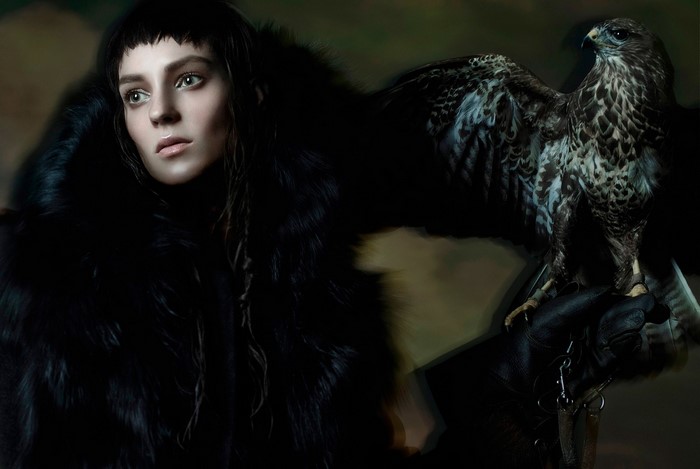 Woman in fur coat with a hawk