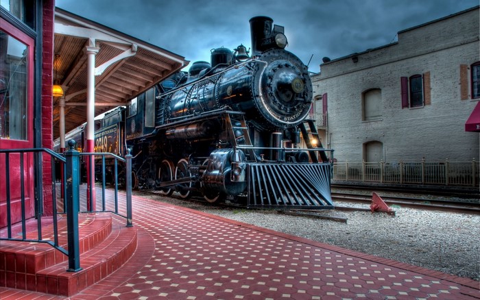 Steam locomotive at a train station