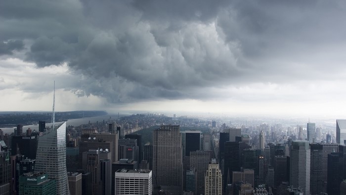 New York City skyline under stormy clouds