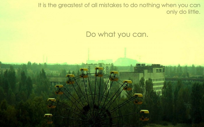 Ferris wheel in abandoned city with motivational quote