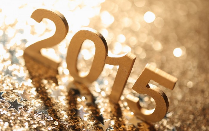 Golden 2015 numbers on glitter background