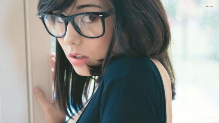 Woman with glasses and black hair