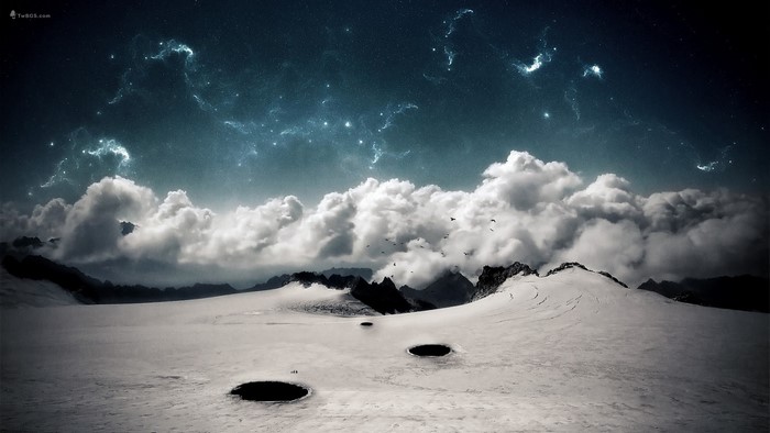 Snowy mountains under a starry night sky with clouds