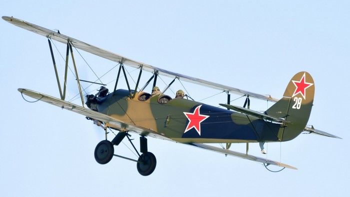 Polikarpov Po-2 biplane in flight with red stars