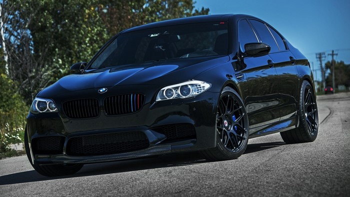 Black BMW M5 Sports Sedan on Road