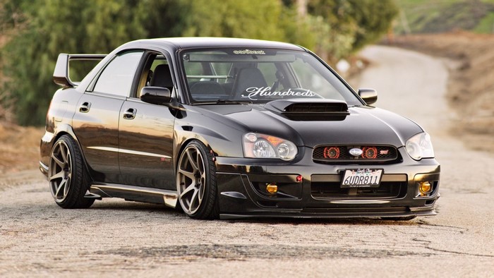 Black Subaru Impreza WRX STi with custom wheels