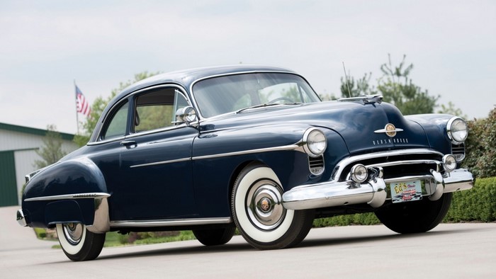 Dark Blue 1950s Oldsmobile Sedan with Whitewall Tires
