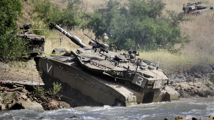 Merkava Mark IV tank crossing a river
