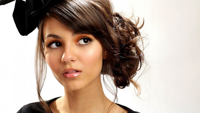 Victoria Justice portrait with black fascinator