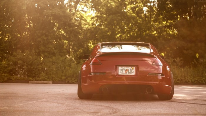 Red Nissan 350Z sports car in parking lot