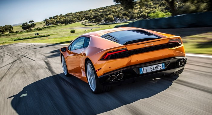 Orange Lamborghini Huracan LP 610-4 on a race track