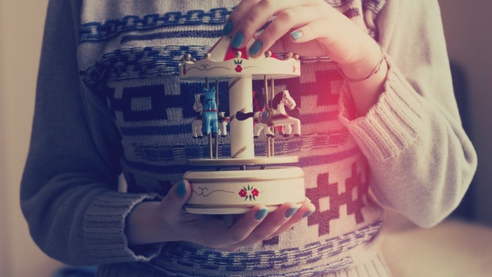 Person holding a carousel music box