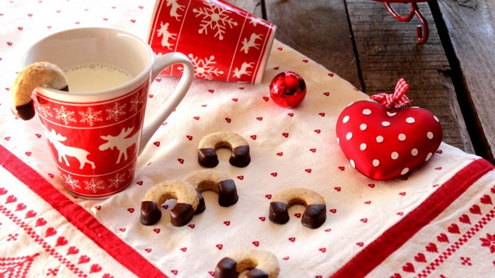 Christmas cookies and milk with festive decorations