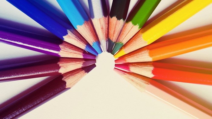 Close up of colorful pencils arranged in a circle
