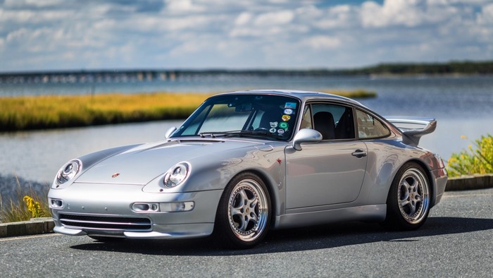 Silver Porsche 911 Classic Sports Car by the Water