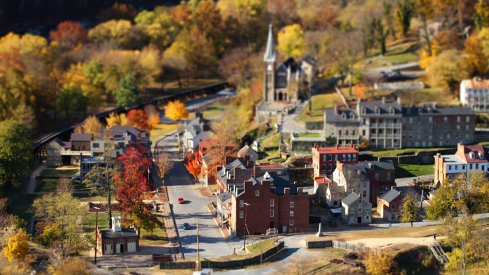 Autumn town with church and colorful trees
