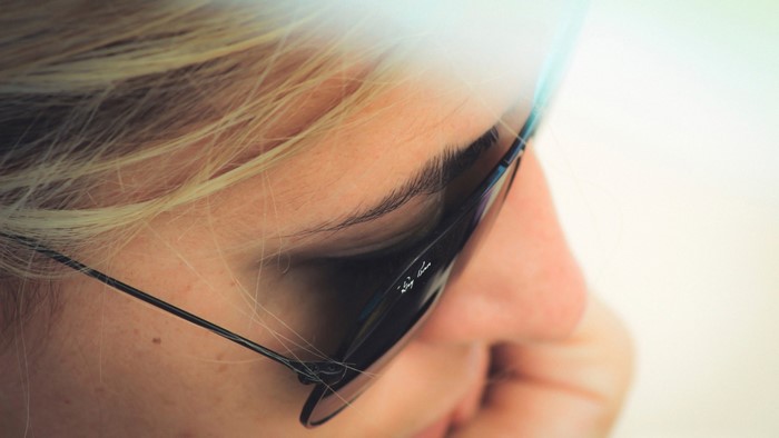 Close-up of a woman wearing Ray-Ban sunglasses