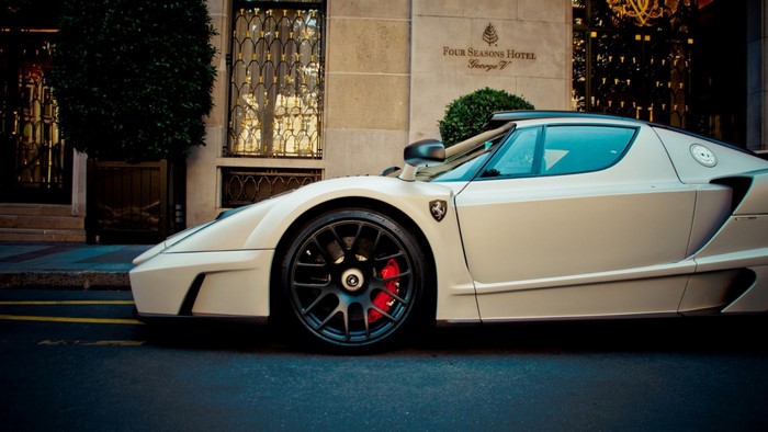 White Ferrari Enzo Ferrari parked outside Four Seasons Hotel George V