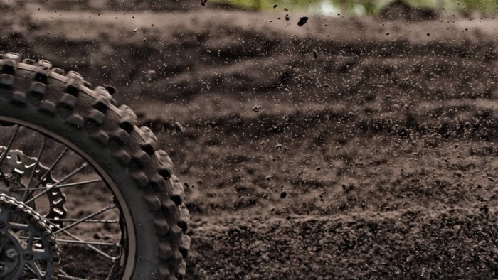 Motocross tire kicking up dirt