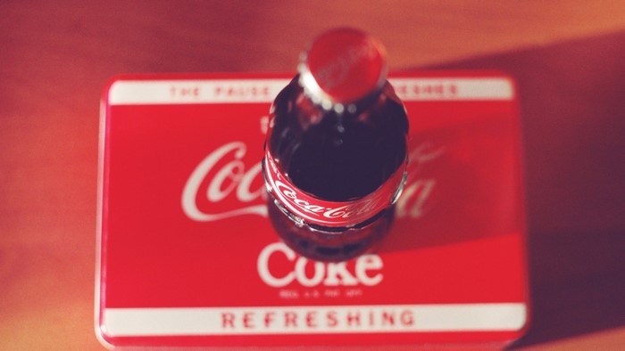 Coca-Cola bottle on a Coca-Cola branded surface