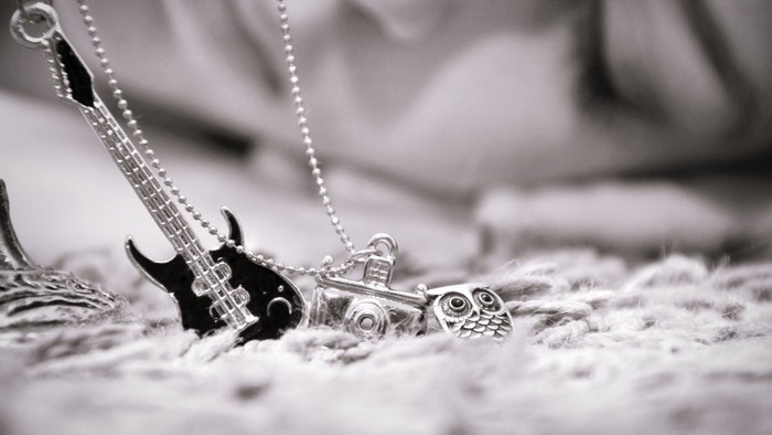 Close up of a silver necklace with charms