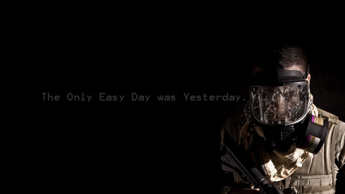 Man in gas mask with text