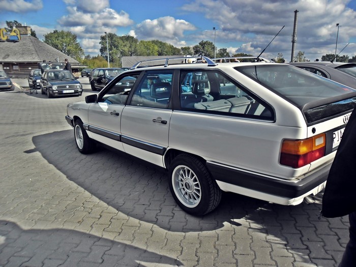 White Audi 100 Avant parked on a paved lot