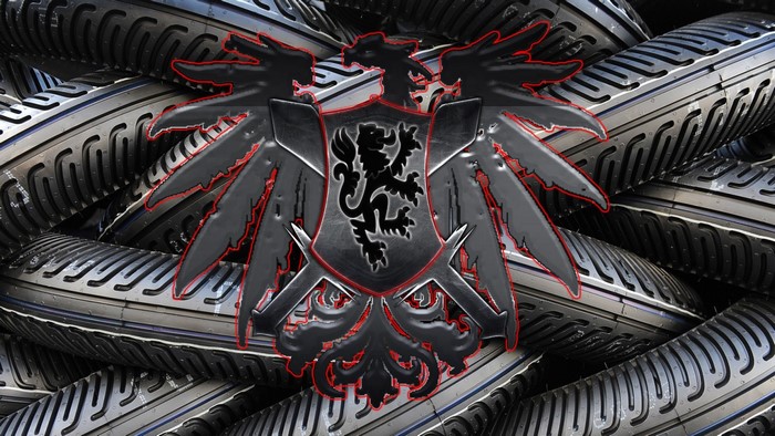 Coat of arms with lion and eagle over tires
