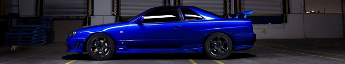 Blue Nissan Skyline GT-R R34 sports car