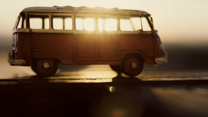 Toy van with sunlight filtering through windows