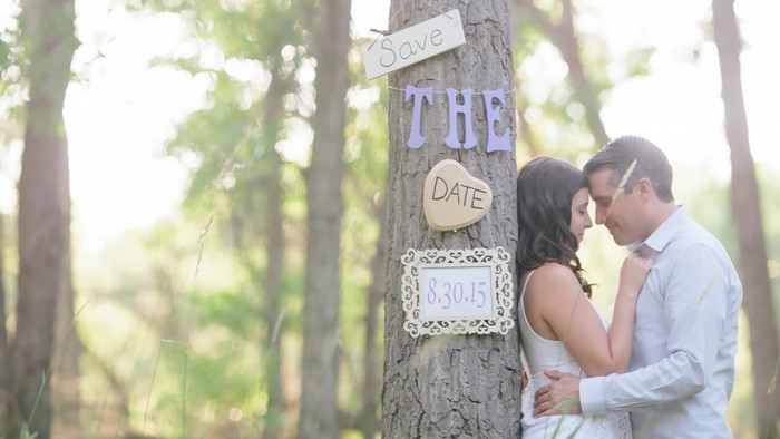 Couple posing for save the date photo