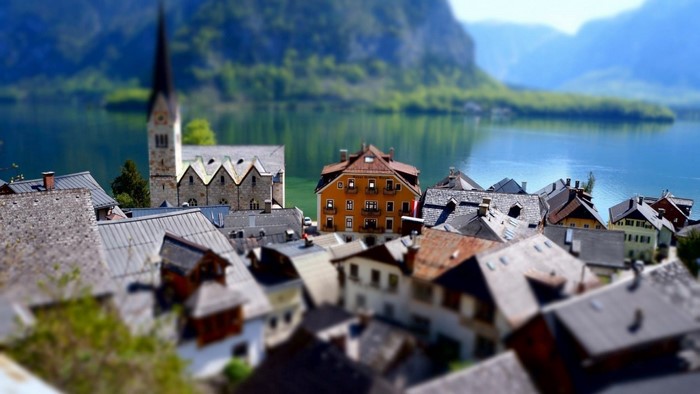 Tilt shift cityscape of Hallstatt with lake and mountains