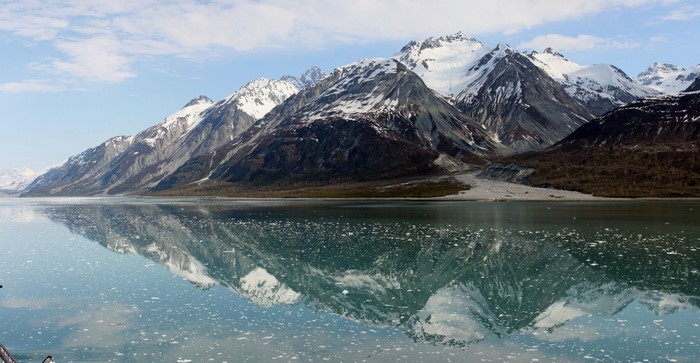 Snow-capped mountains reflected in a glacial lake