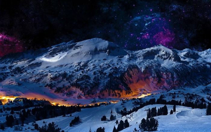 Snowy mountains under a starry night sky