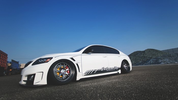 White custom sedan with racing rims