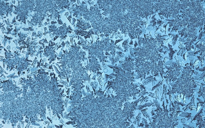 Close-up of frost crystals on a surface