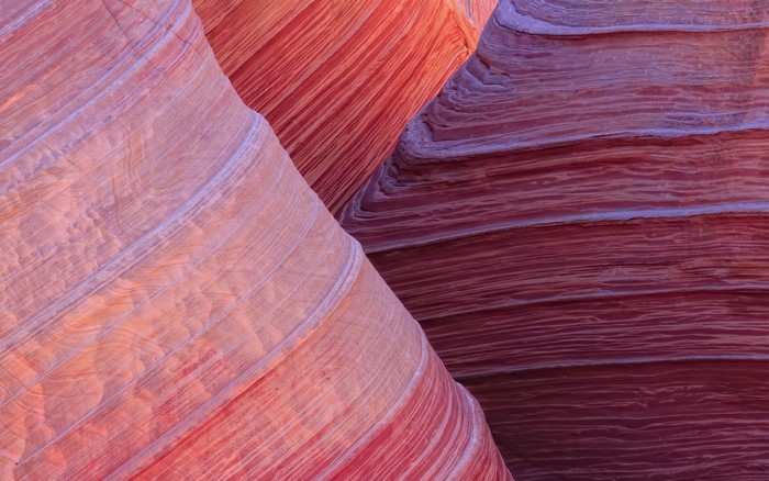Close up of sandstone rock formations with red and pink hues