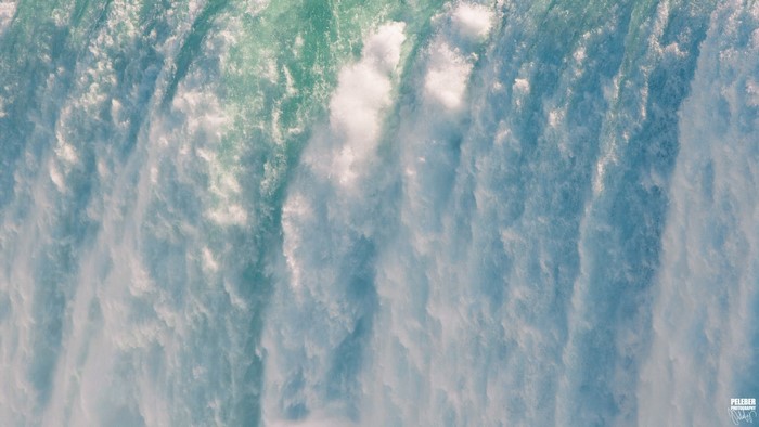 Close-up of a waterfall with turquoise and blue water