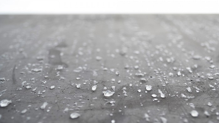 Water droplets on a dark surface