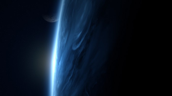Planet and moon in outer space with atmospheric glow