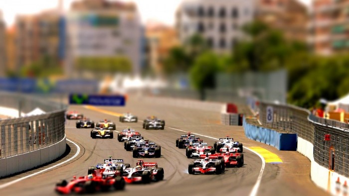 Formula 1 race cars on a city street circuit