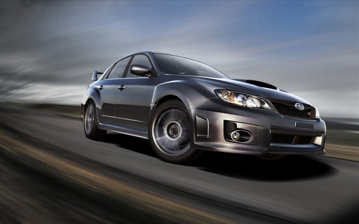 Subaru Impreza WRX STi Sedan driving on a road