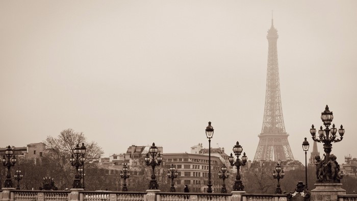 Eiffel Tower and Paris cityscape with ornate lampposts