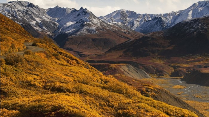 Autumn mountain valley with a winding road