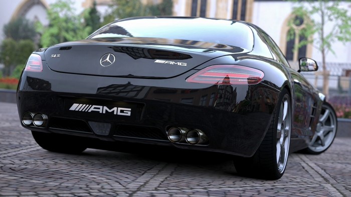 Black Mercedes Benz SLS AMG parked on cobblestone street