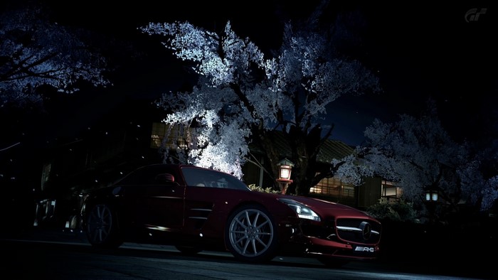 Mercedes-Benz SLS AMG GT3 at night with cherry blossoms
